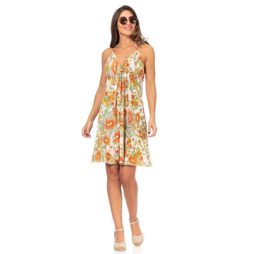 Front of knee-length, v-neck white dress with vibrant orange, yellow, & green paisley floral pattern.