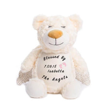 Load image into Gallery viewer, Cream colored teddy bear with shimmer wings, closed eyes, calm smile, and &quot;Blessed By The Angels&quot;, a child&#39;s name and birthdate, and a pair of pink baby feet on belly
