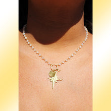 Load image into Gallery viewer, Model showing medium length of necklace around neck.
