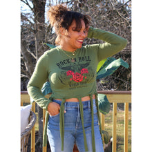 Load image into Gallery viewer, Front view of fringe tie over crop top with rock N&#39; roll design and light wash jeans
