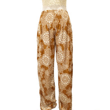 Load image into Gallery viewer, Terra-cotta brown harem pants with white boho floral print.
