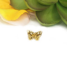 Load image into Gallery viewer, Front view of butterfly ear cuff with cutouts.
