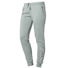 Load image into Gallery viewer, Left side view of pants with matte silver “Serenity” and 3 flowers running down pant leg.
