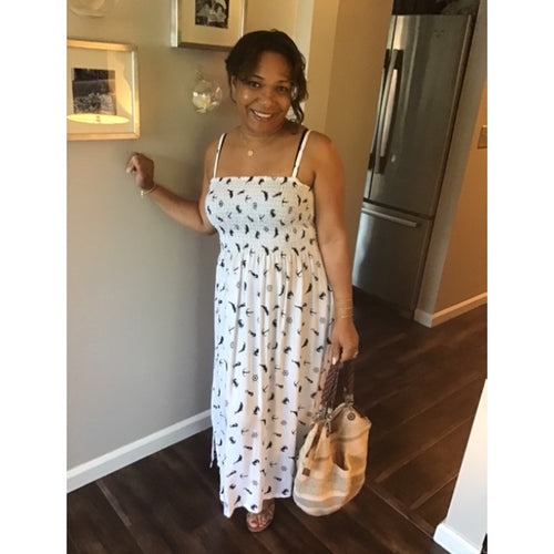 Model Wearing Seashore Sundress With Hammered Medallion Necklace